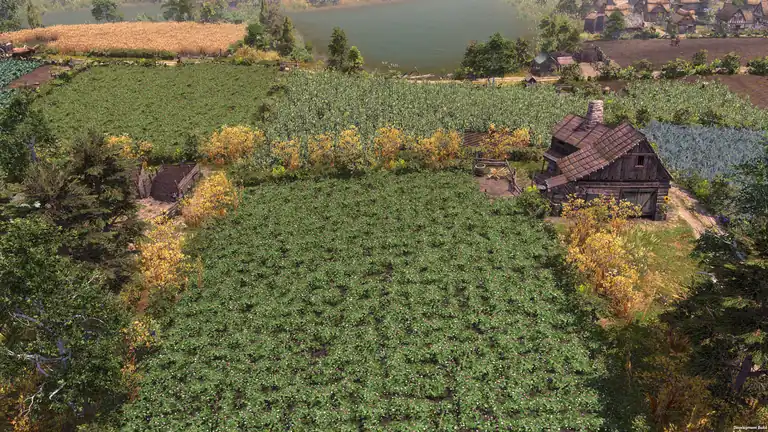 Farthest Frontier crop fields of different crops next to a farmhouse at the end of summer