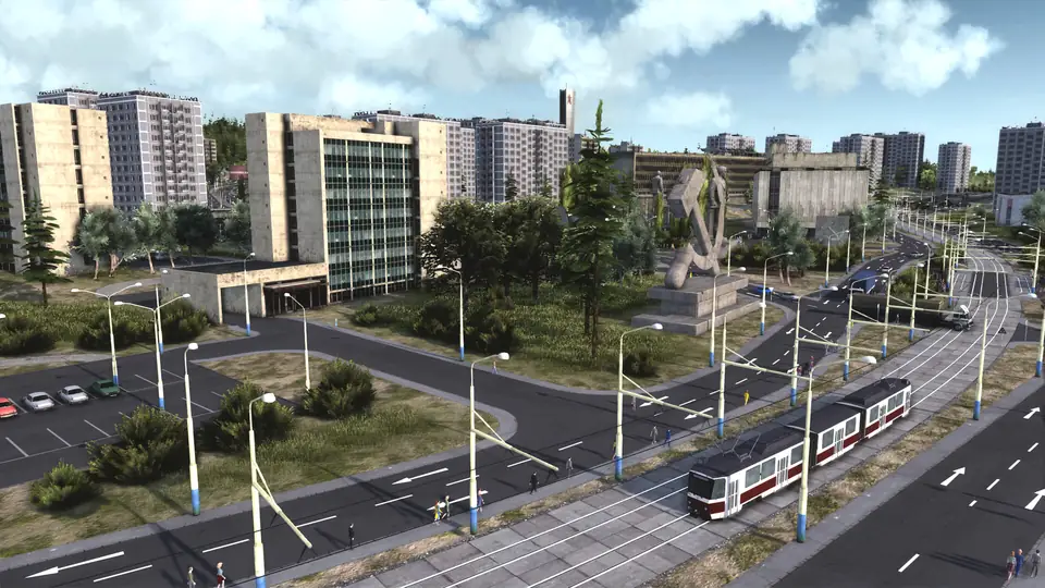 Prefab apartment towers along a tram line and a wide boulevard.