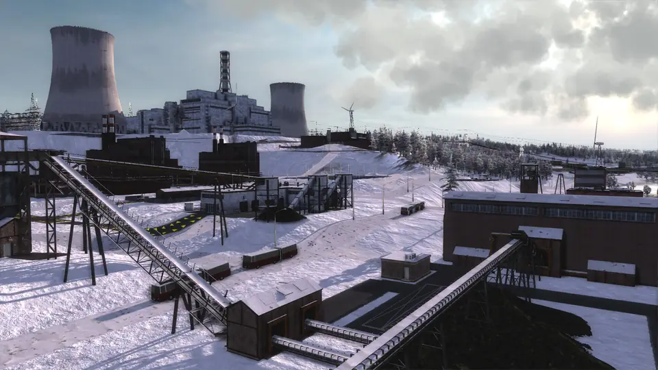 A winter power station: cooling towers, a coal conveyor and snow-covered plant buildings.